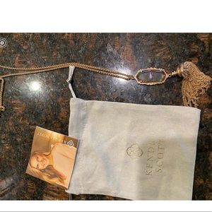 Long rose gold colored necklace